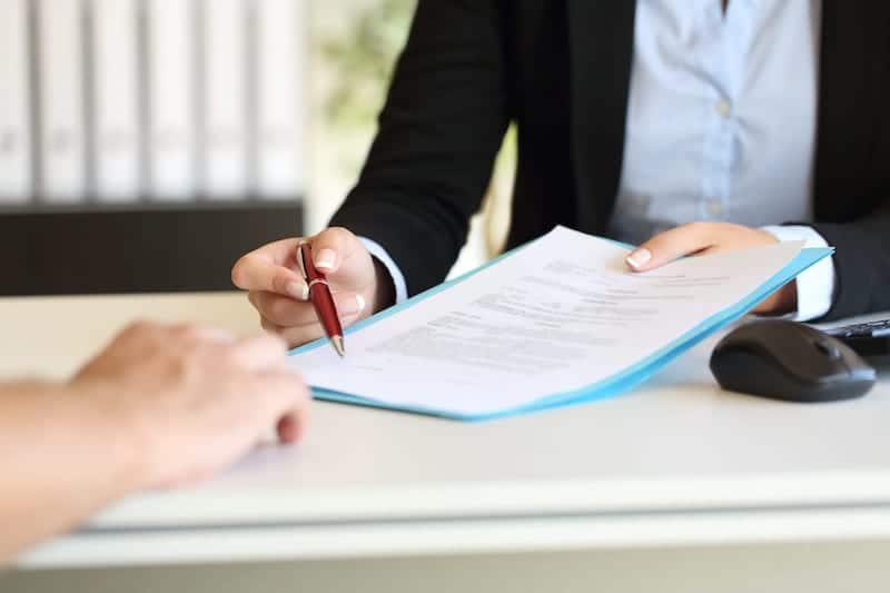 Lawyer Asking A Client To Sign Documents